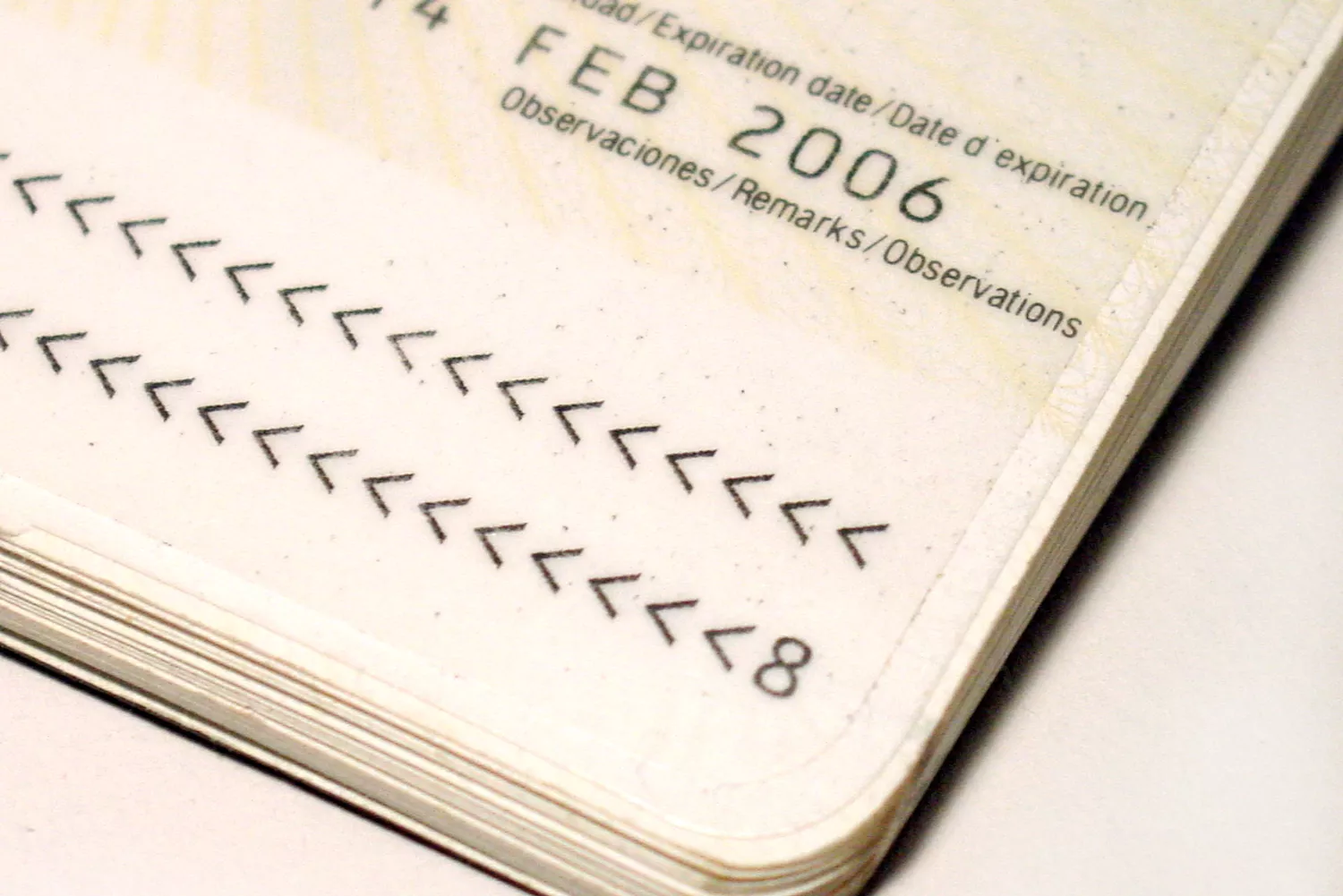 Close-up of a passport's identification page specifically focusing on the expiration date area.