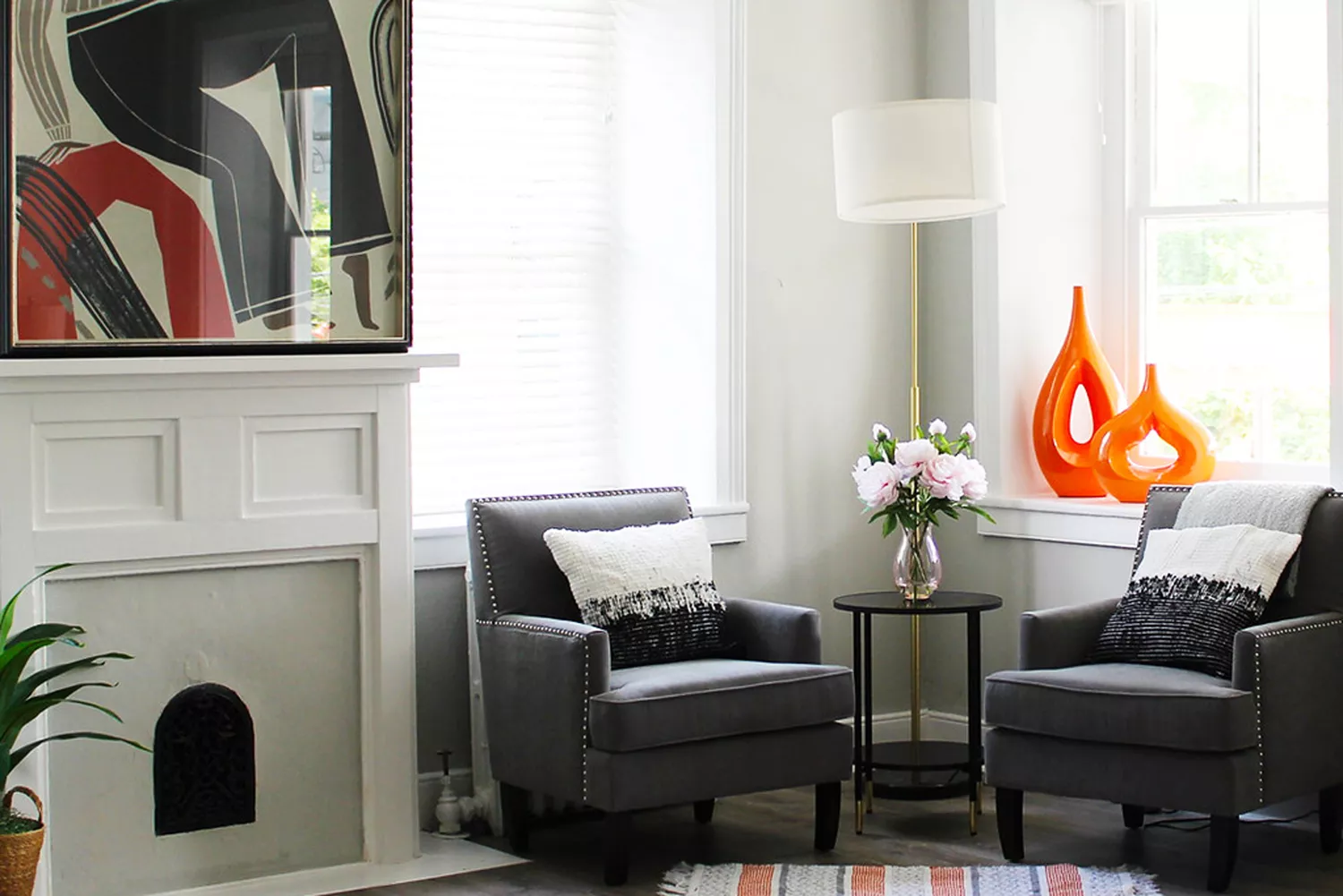 A luxury guest room interior at The National Hotel featuring Victorian-style armchairs and a fireplace.