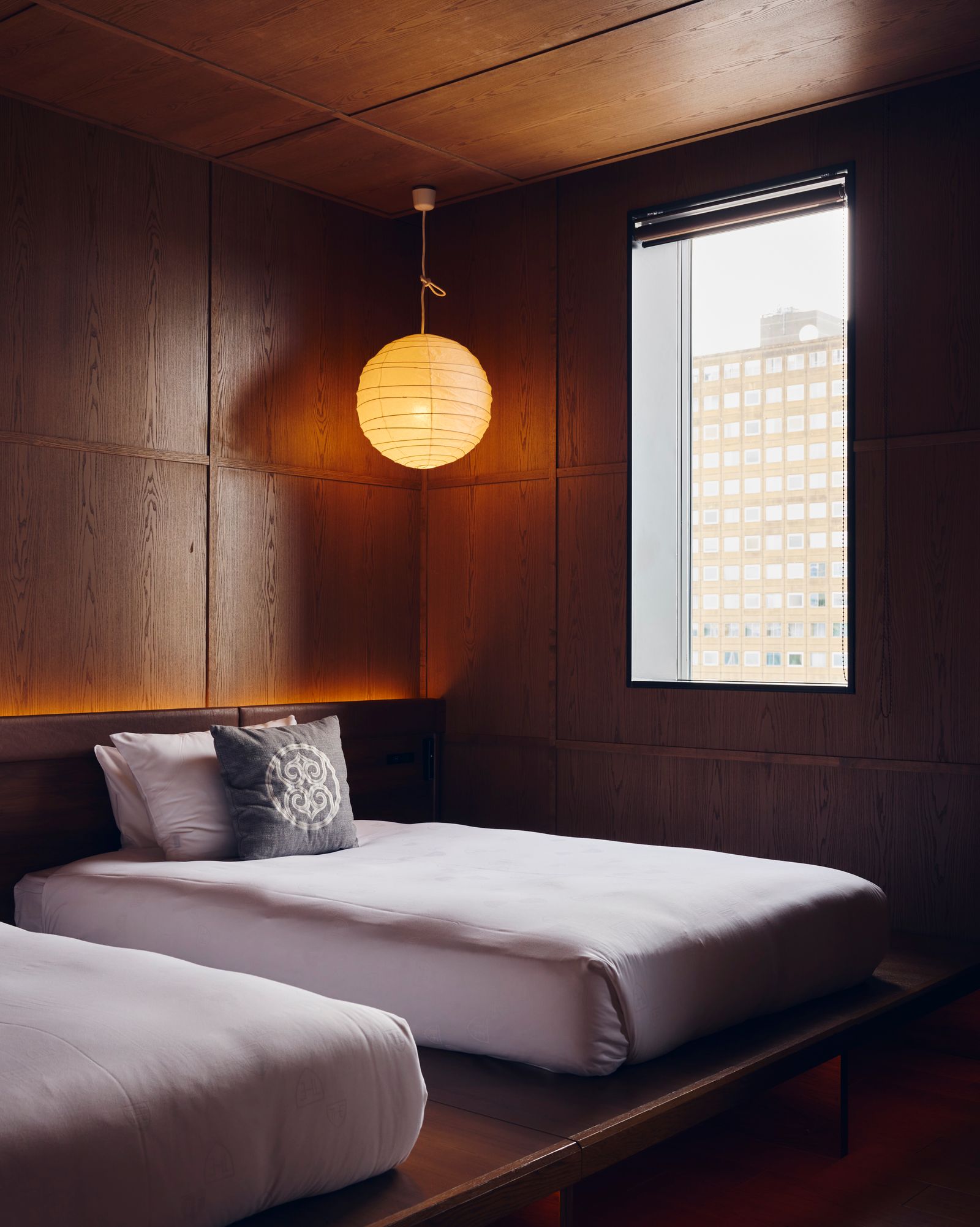 A stylish and modern hotel room interior in Sapporo with cozy furnishings.
