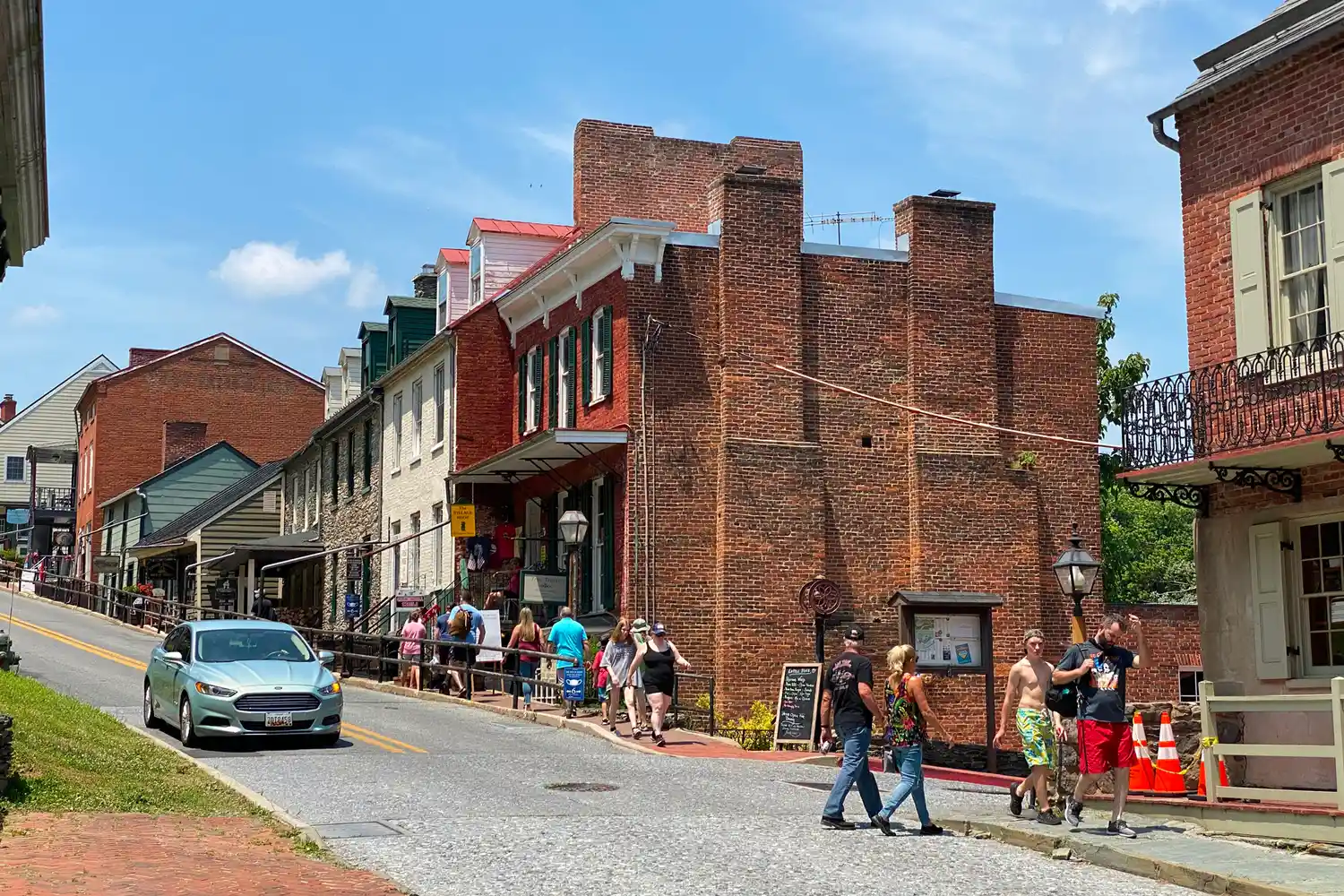 Tourists walking through the historic streets of Harpers Ferry National Historical Park.