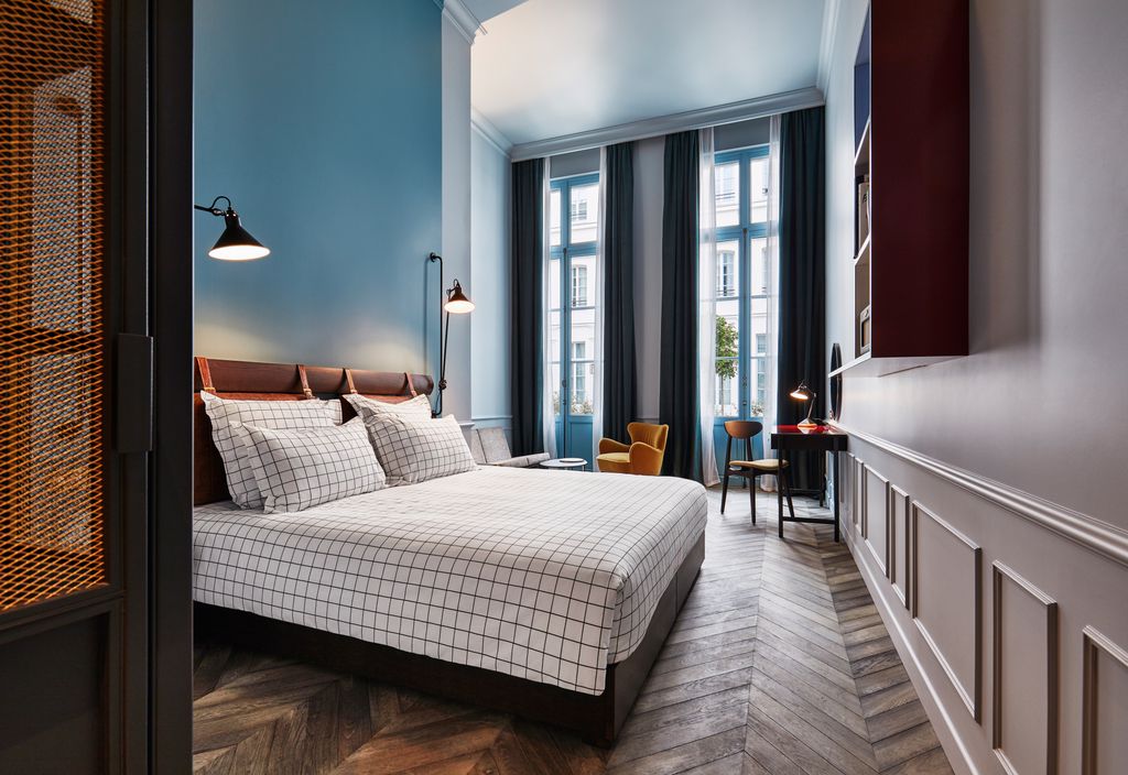 The stylish, mid-century inspired guest room at The Hoxton Paris.