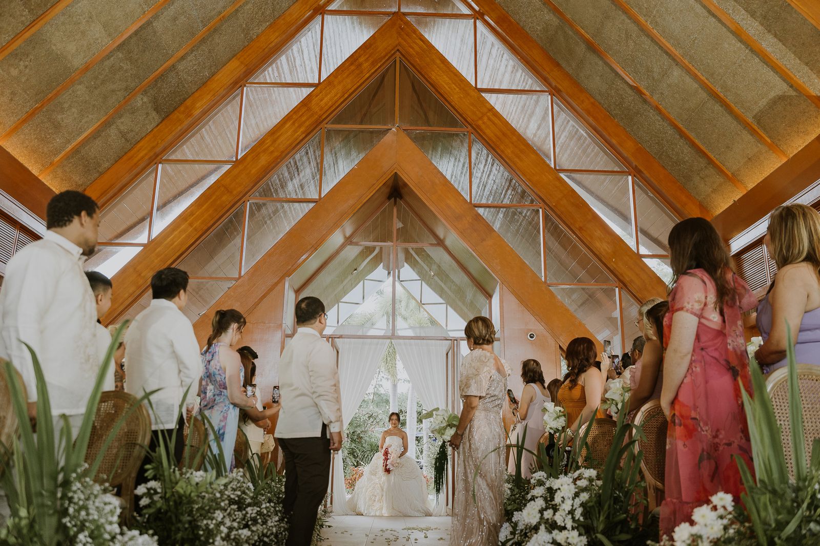 A detailed view of a luxury wedding gown showing intricate fabric and design.