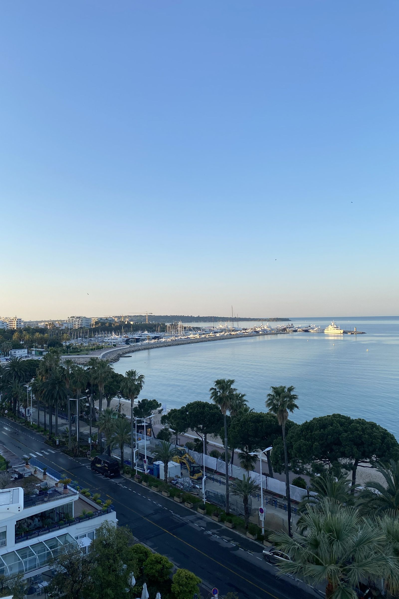 The grand Art Deco architecture of a seaside hotel in Cannes reflecting the Mediterranean light.