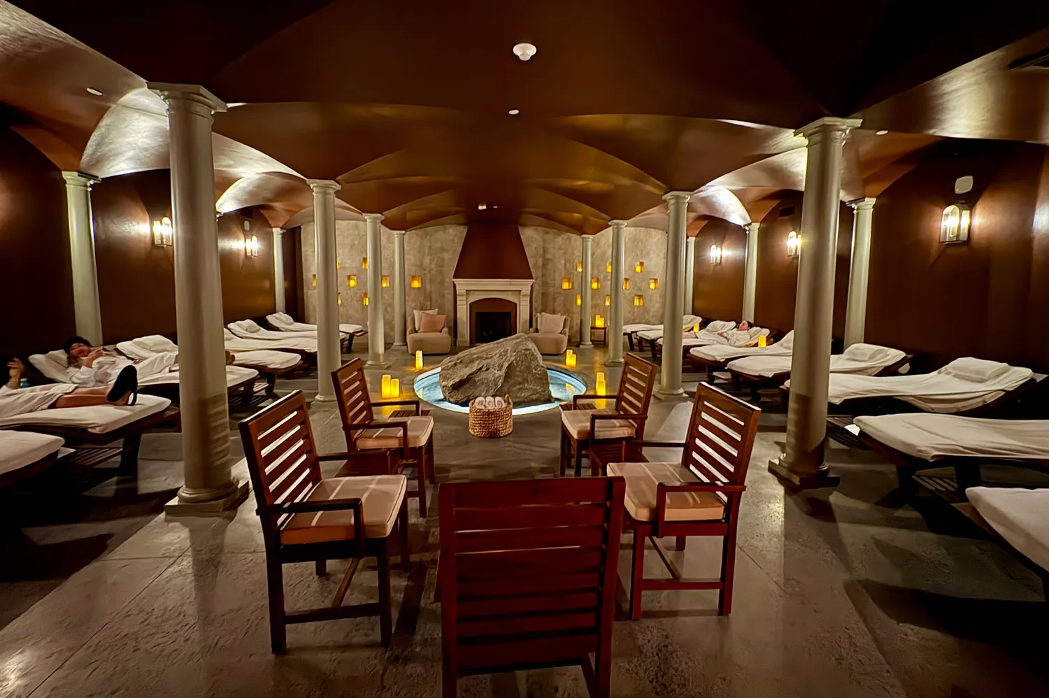A tranquil spa relaxation lounge with comfortable seating and soft lighting.