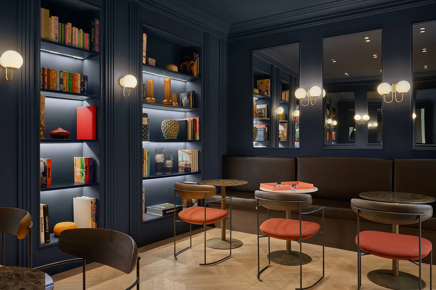 Cozy library-themed lounge area with bookshelves and soft mood lighting.