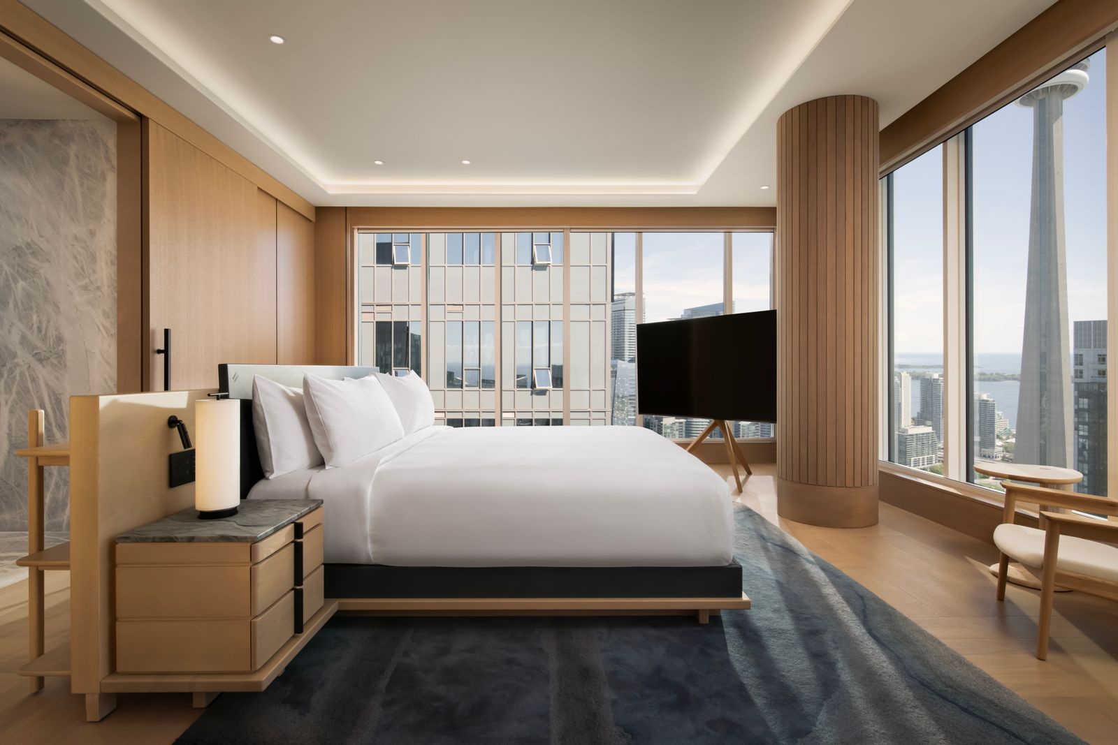 Modern luxury hotel room with high-end furniture and design.