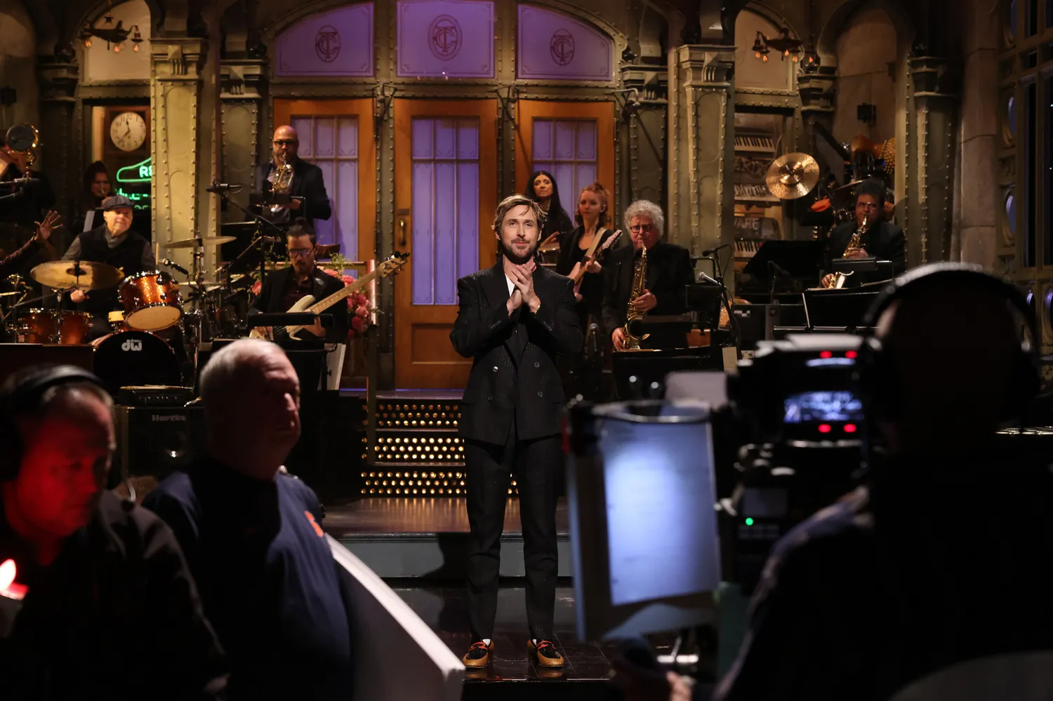 Ryan Gosling performing a monologue on the Saturday Night Live stage.