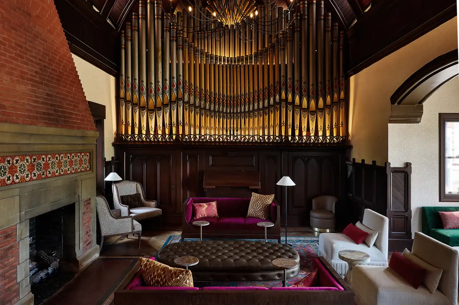 The interior of the Music Room featuring a large pipe organ and a fireplace.