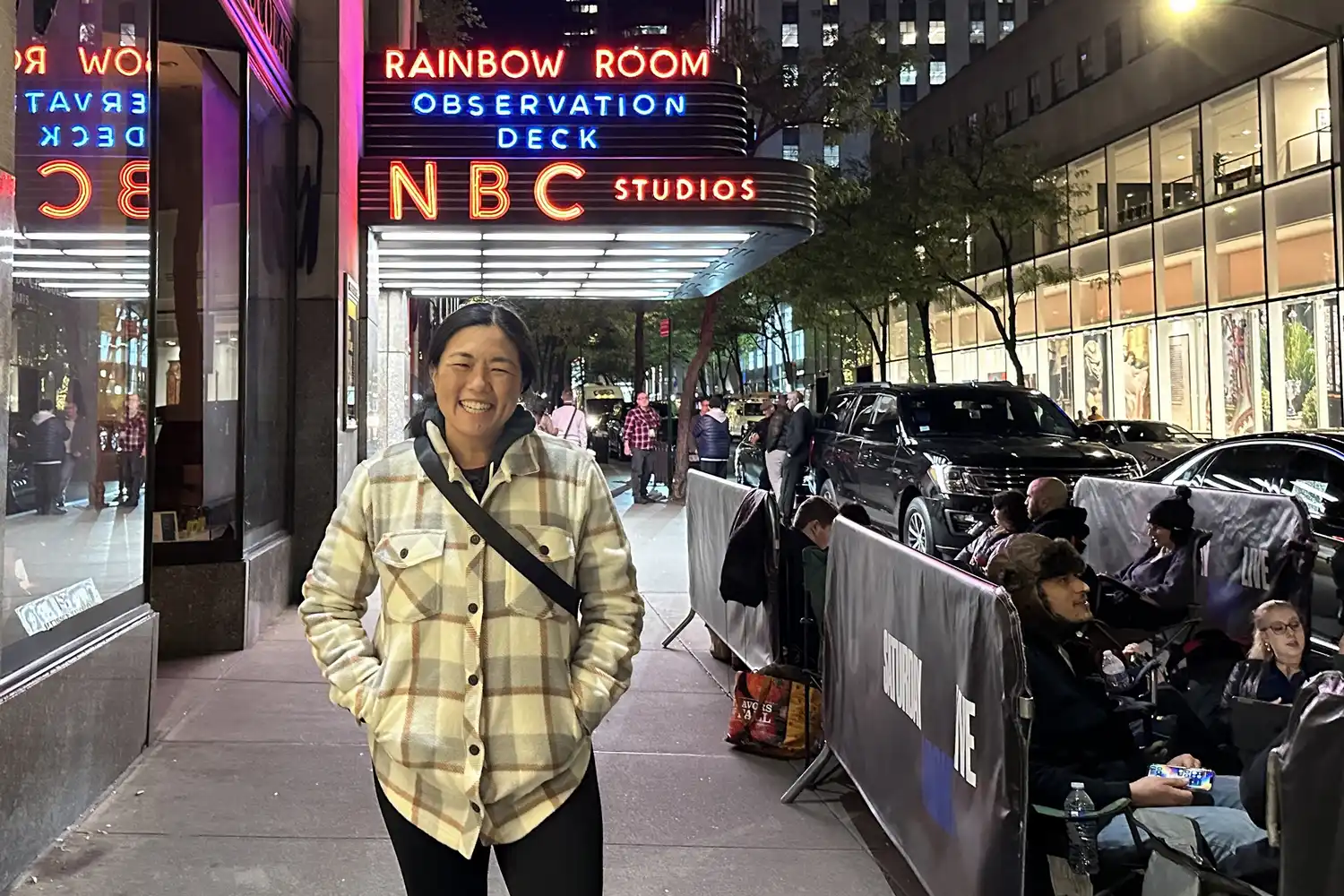A person standing next to the SNL standby line queue outside NBC Studios.