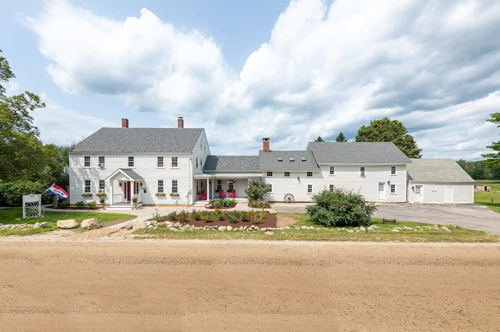 The iconic two-story white building with red accents of a classic New England seafood restaurant.