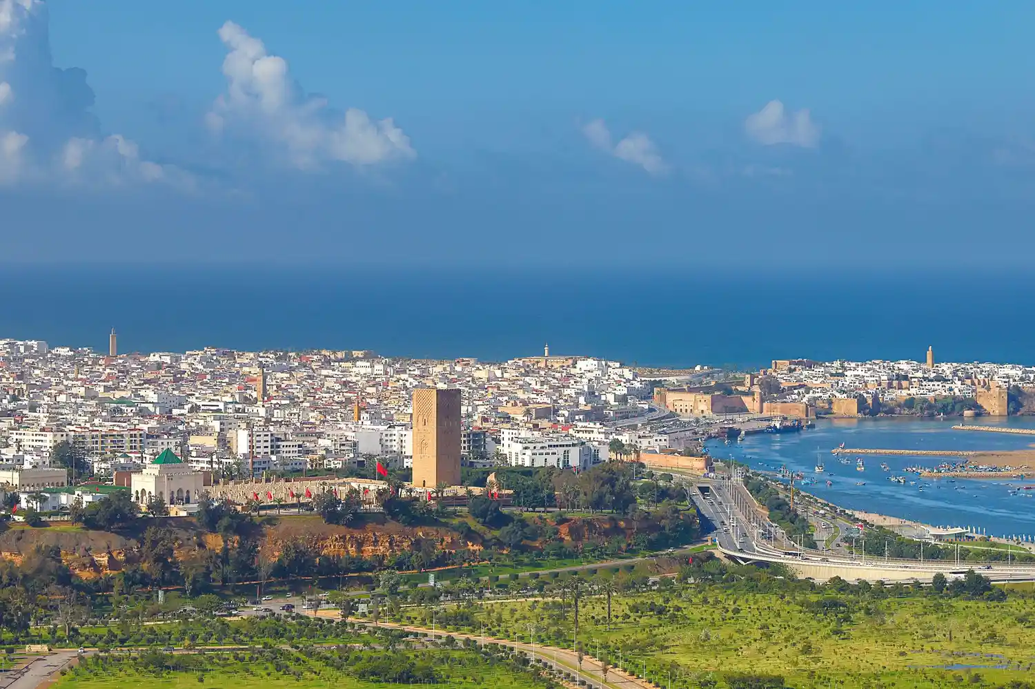 Aerial view of Rabat and Sale cities divided by the river with the Atlantic ocean in the background.